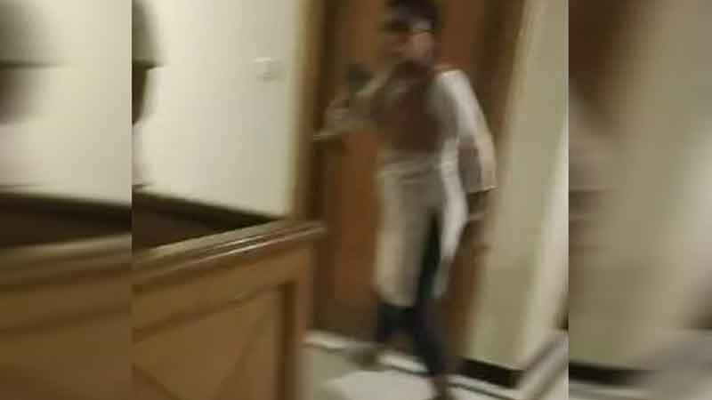The inspector was celebrating with girlfriend in the hotel, then the wife reached and then kicked and punched